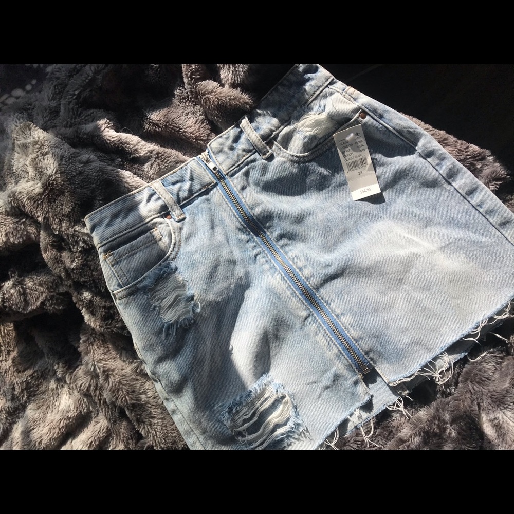 Blue zip up distressed denim skirt
